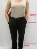 Practical slacks have reinforced belt loops, deep pockets, and a flared hem for ankle holsters.